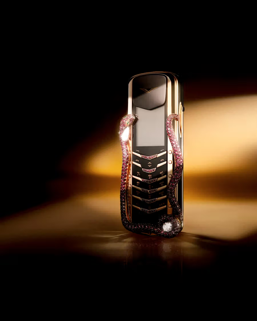 Bespoke 18k gold smartphone with football-textured leather on dark marble
