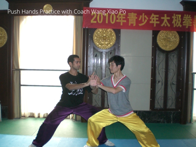 Person practicing Tai Chi in a serene environment