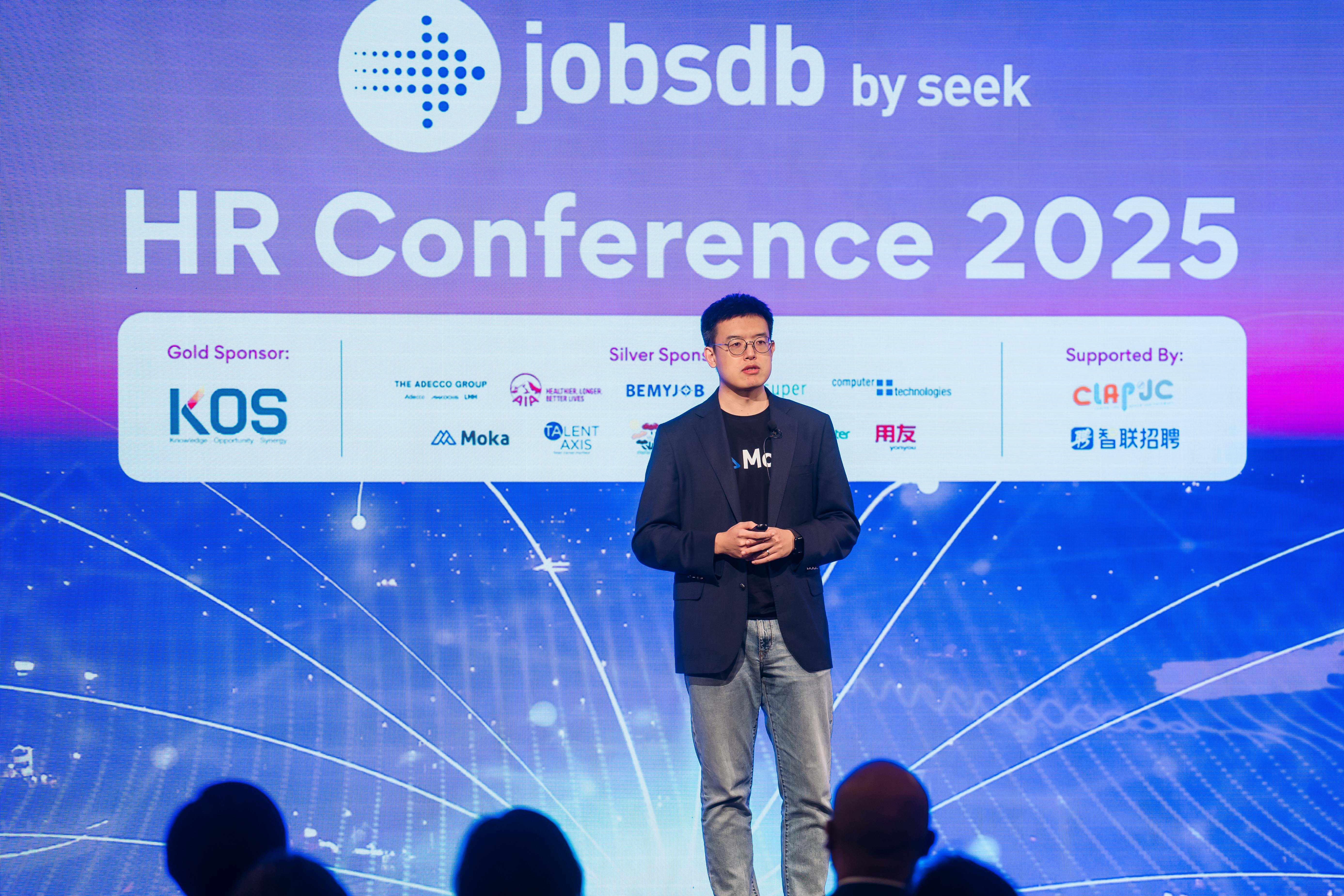 Guoxing stands on stage at the JobsDB HR Conference 2025.