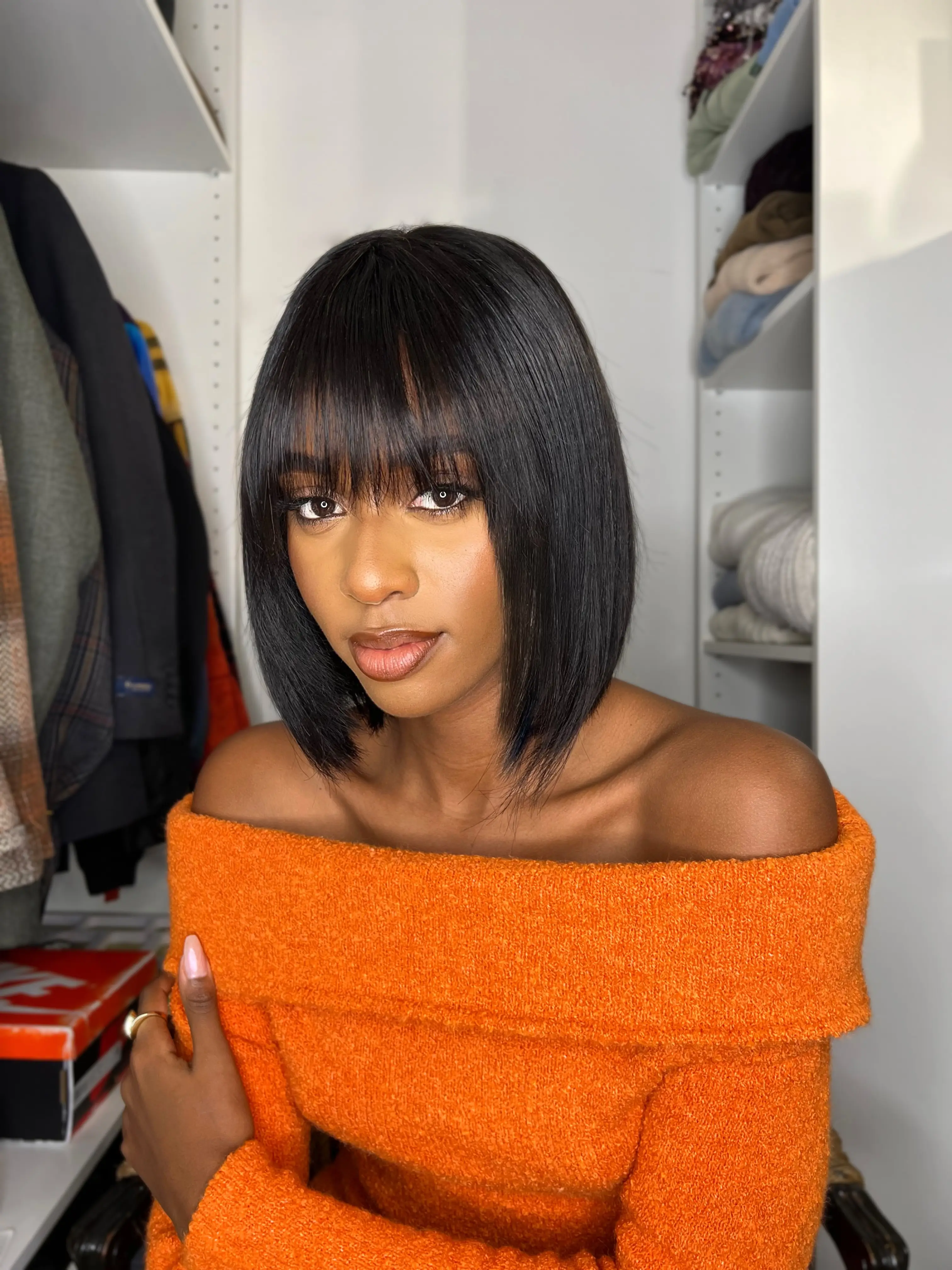 The Evolution of Short Black Wigs with Bangs