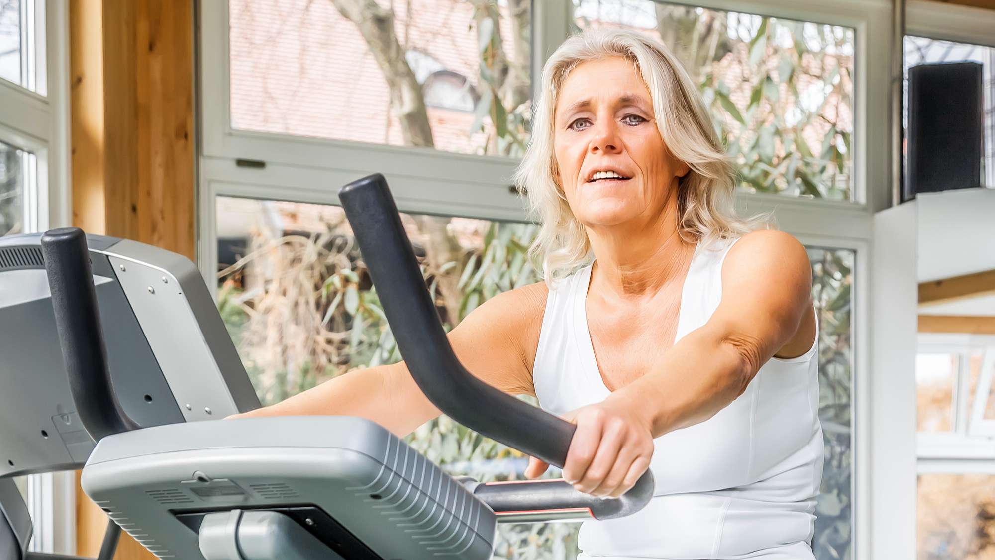 Woman on bike to relieve lower back pain