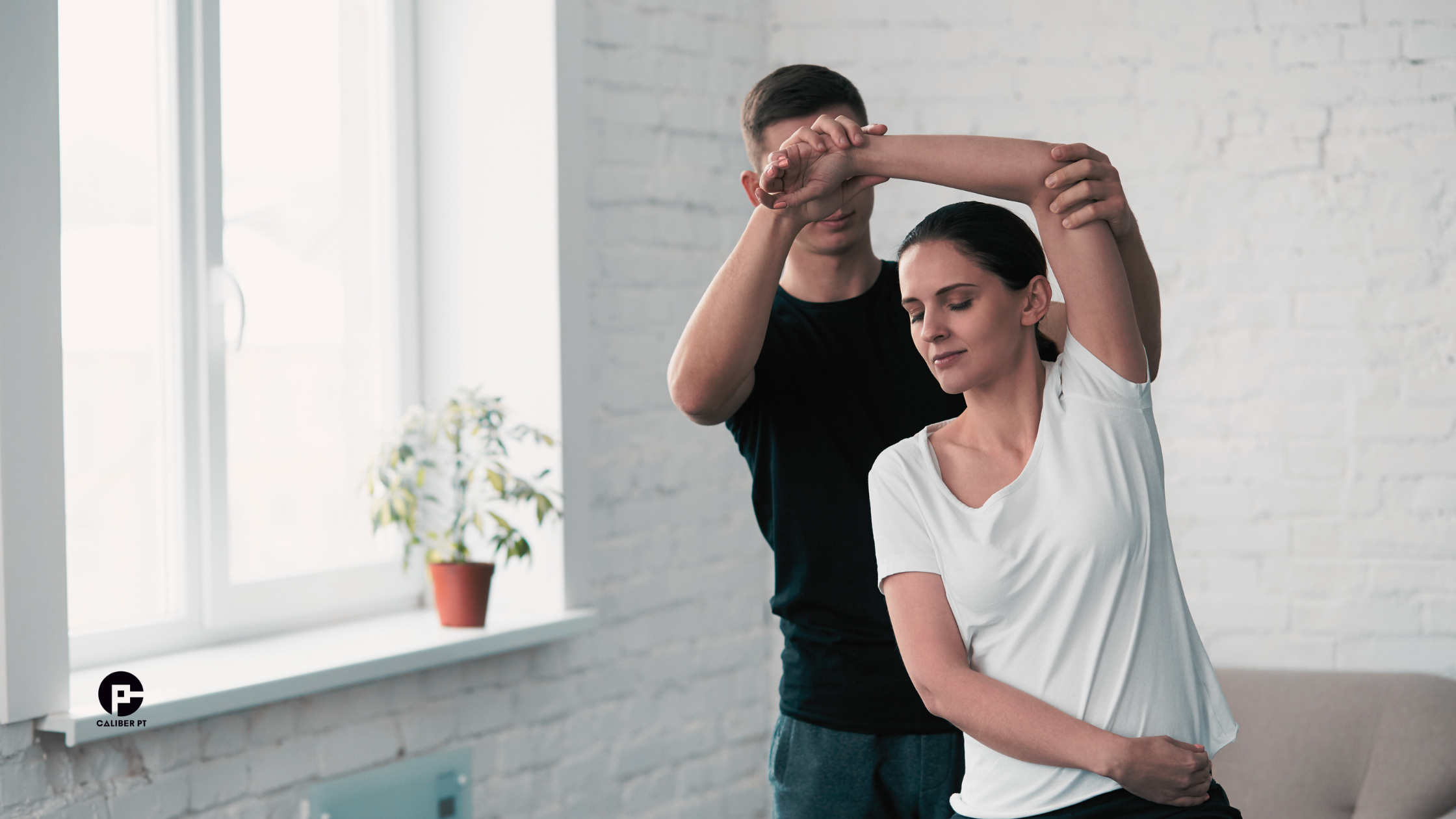 Physical therapist in NYC helping patient with stretch