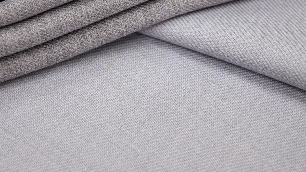 The Fiber Code: How Wool, Cashmere & Blends Define Your Suit’s Personality