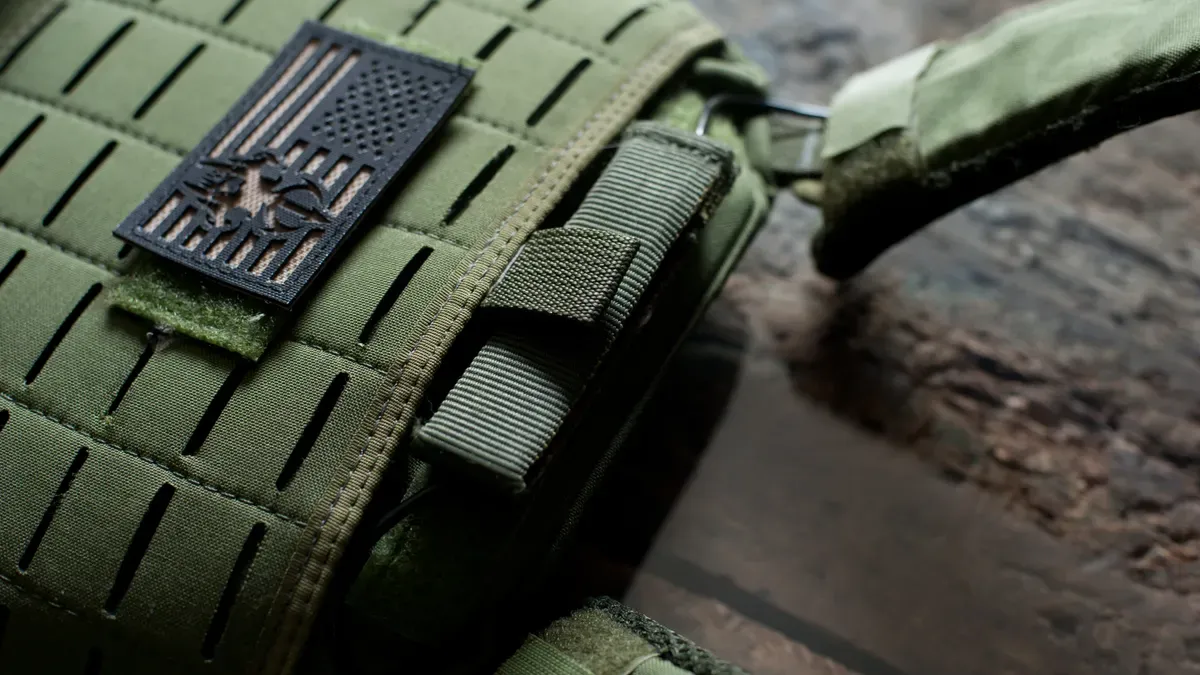 Backpack carrier showing mesh placement below pet breathing zone