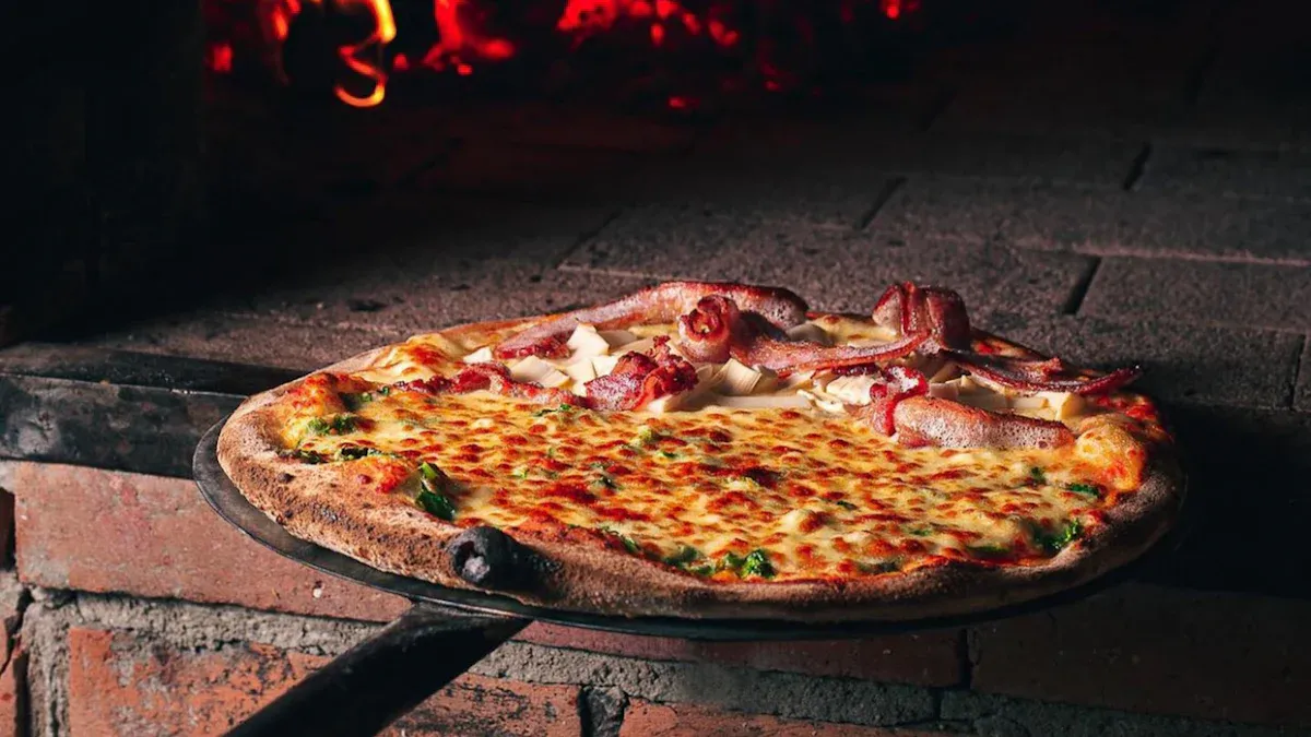 Artisan Menu offerings including sandwiches, pizzas, and locally roasted coffee at Woodland Corner Store