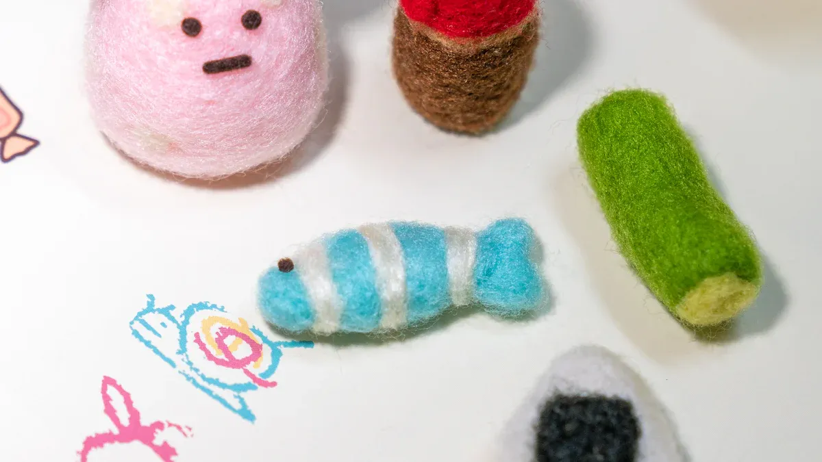 Needle felting supplies: wool roving in several colors with felting needles