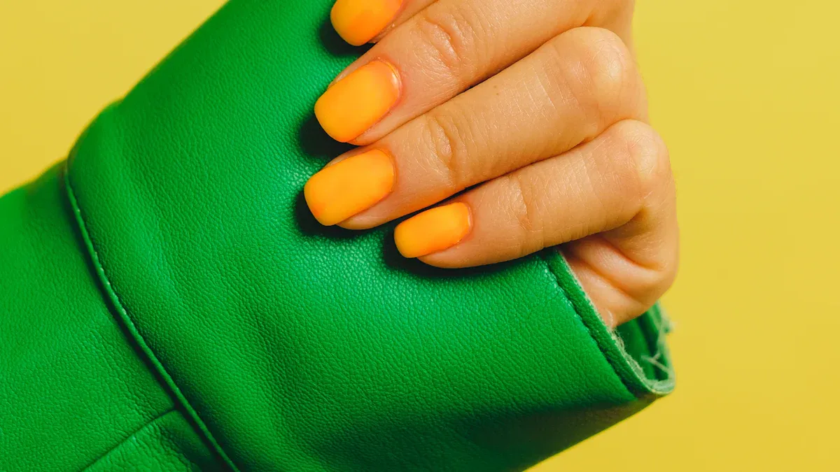 Why orange-colored nails are trending right now