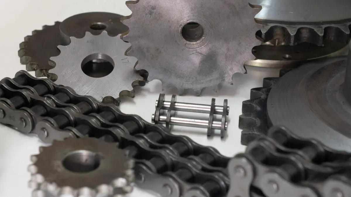 Steel sprockets and roller chain components for an apron conveyor