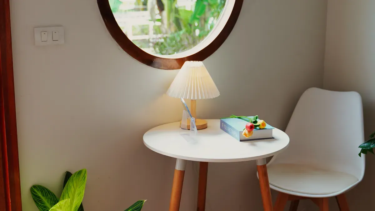 round laminate table tucked into a small dining corner