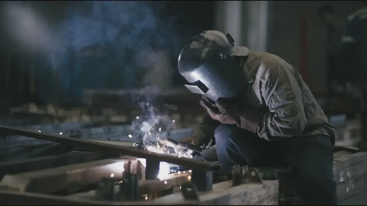 Stud welding process in industrial workshop